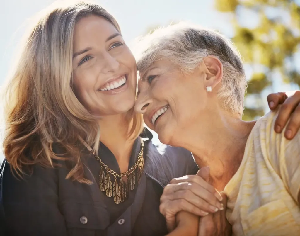 mother and daughter together smiling