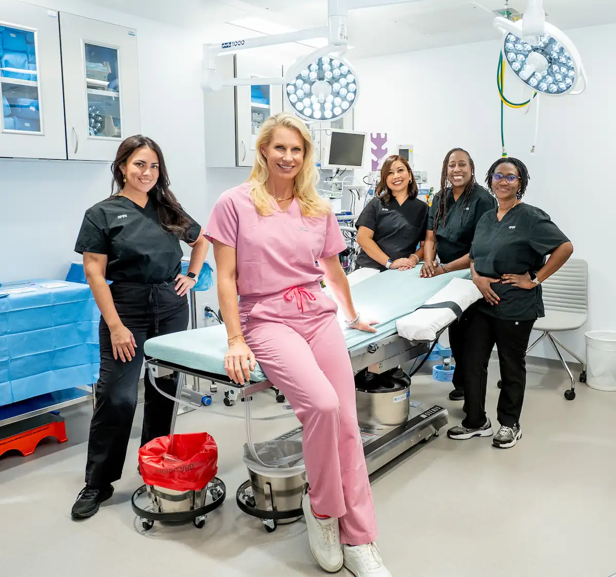 Dr. Karen Horton, Board-Certified Plastic Surgeon, and surgical team in operating room