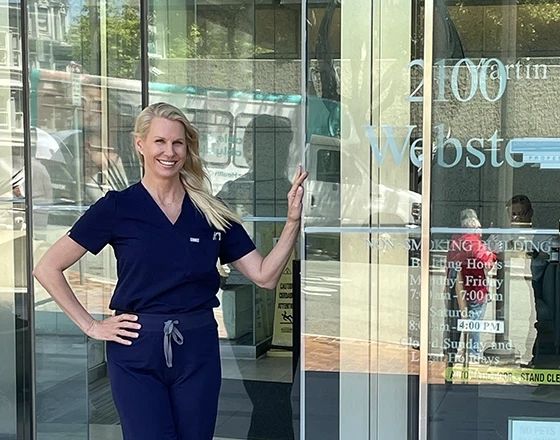 karen horton at 2100 webster building front door
