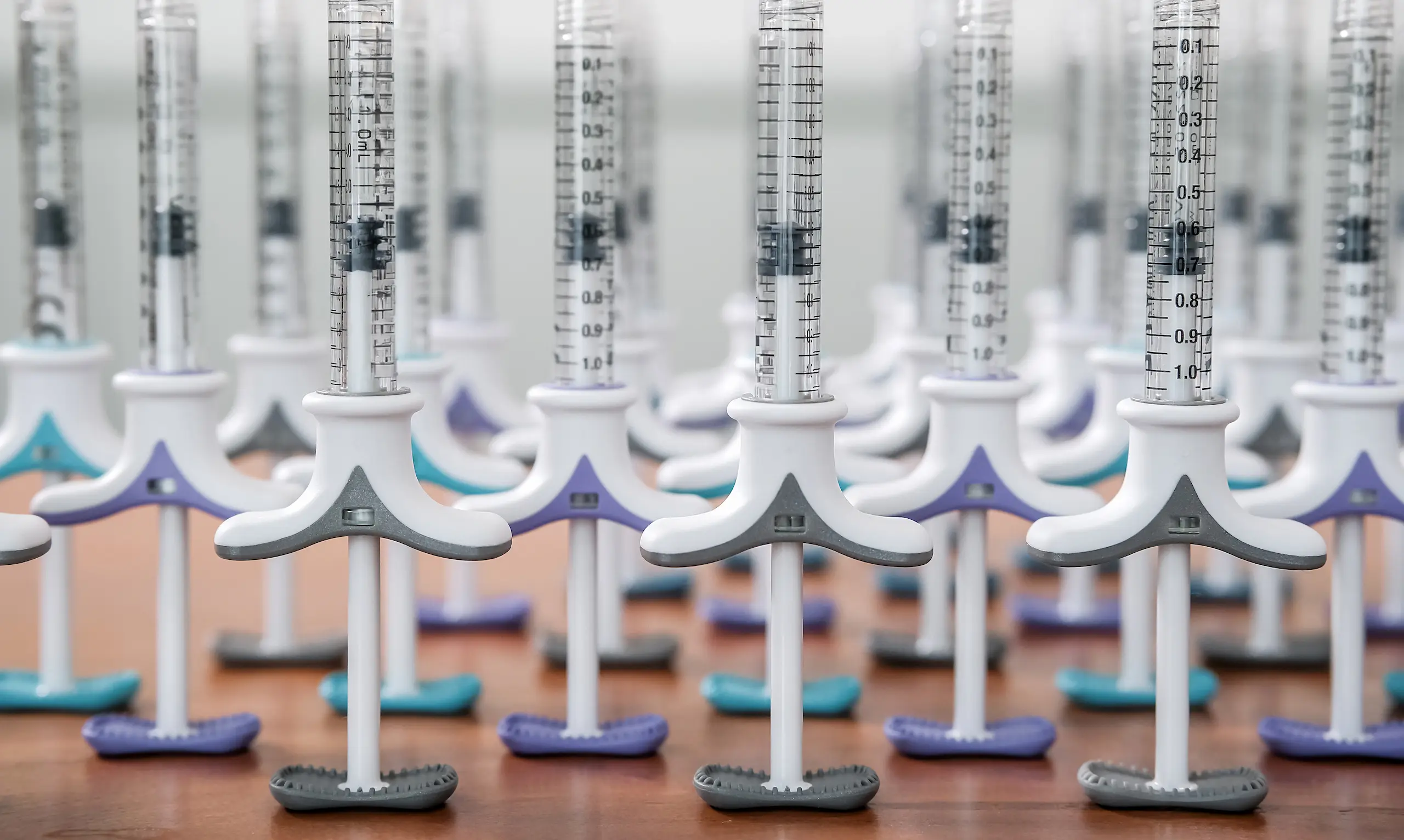 rows of dermal filler syringes