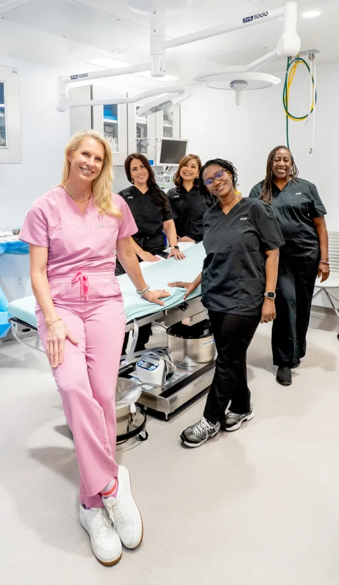 Dr. Karen Horton, Board-Certified Plastic Surgeon, and surgical team in operating room