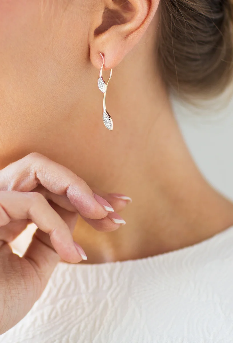 woman wearing larger earrings