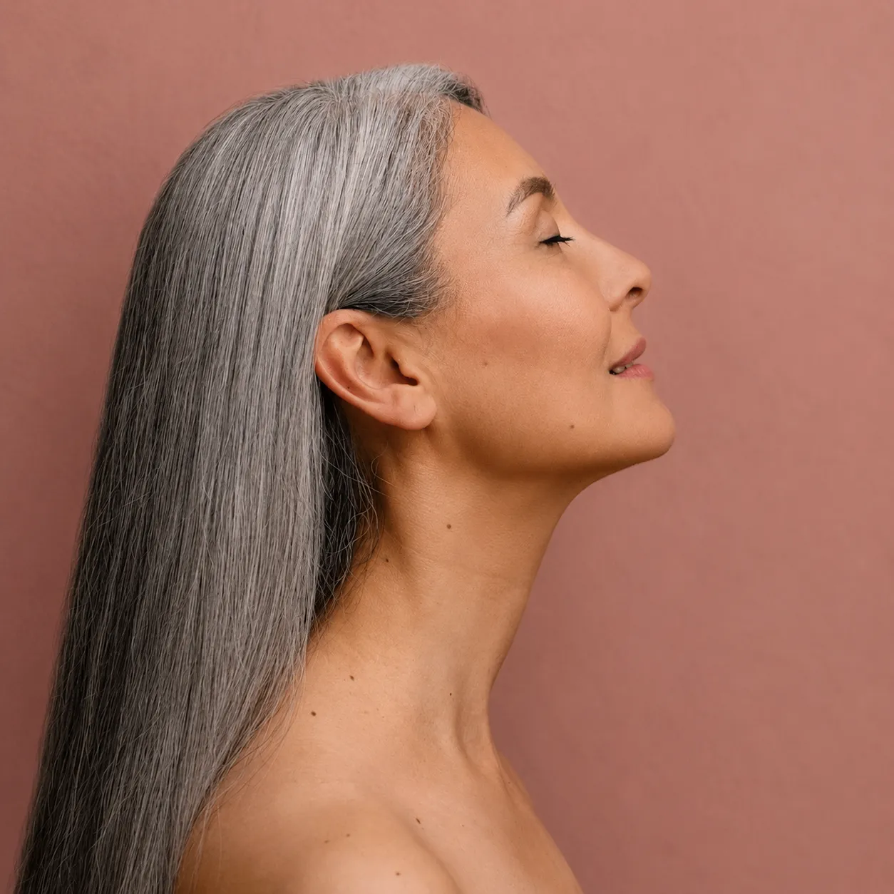 mature woman showing off her neck lift results