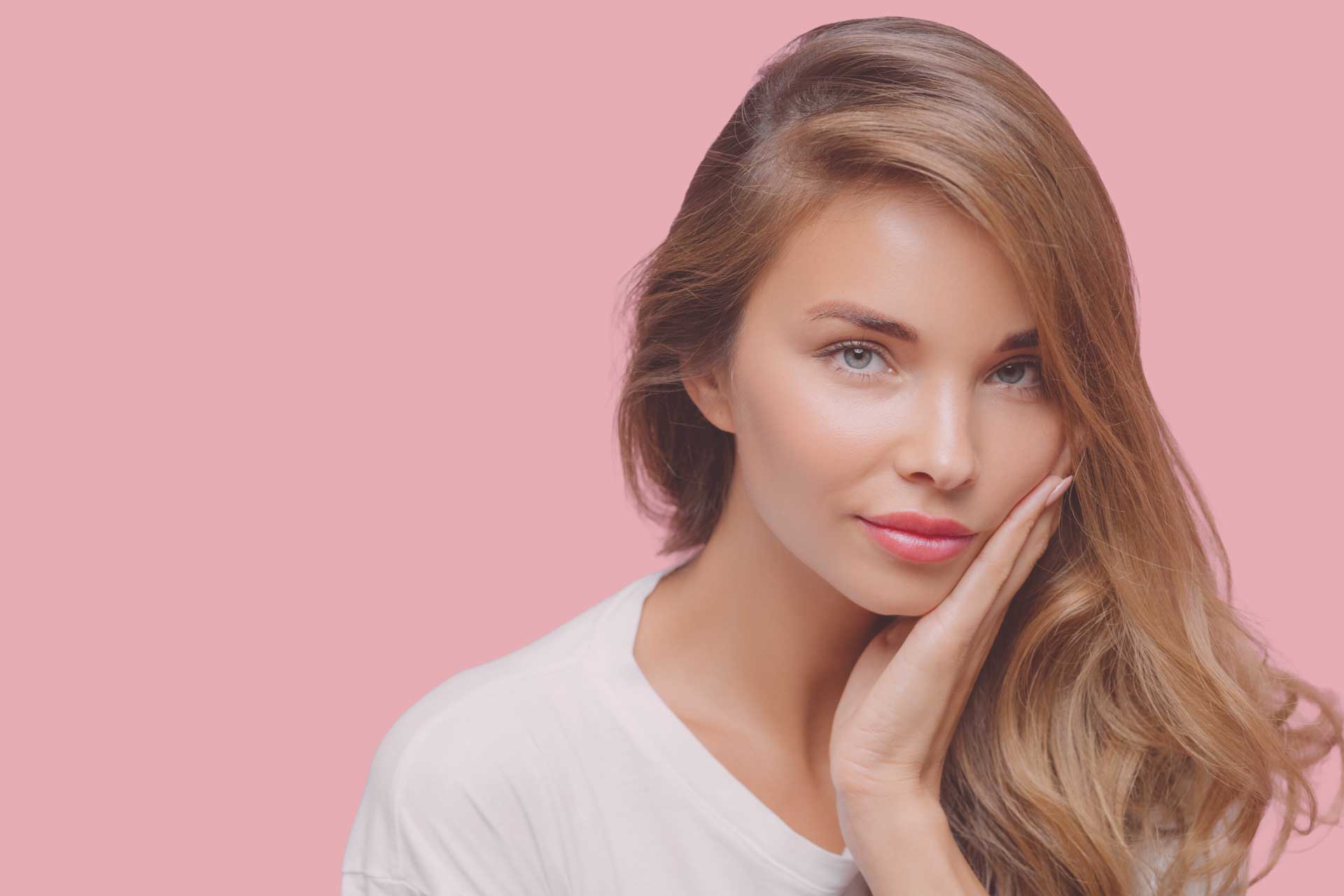 beautiful woman holding her face with her hand