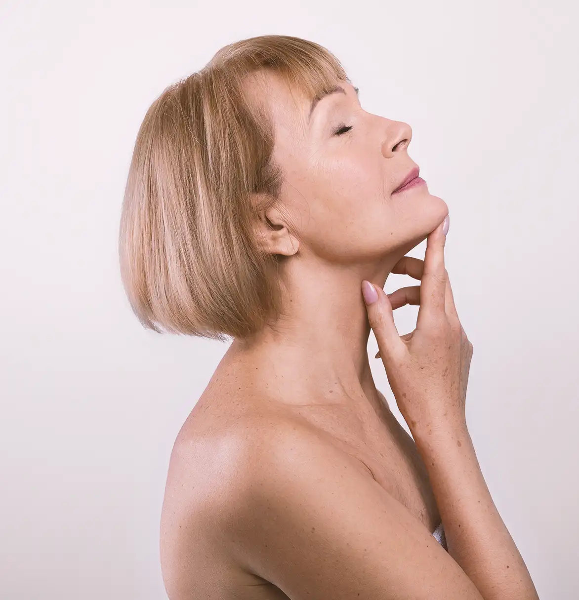 older woman happy with her full hair from prf treatment