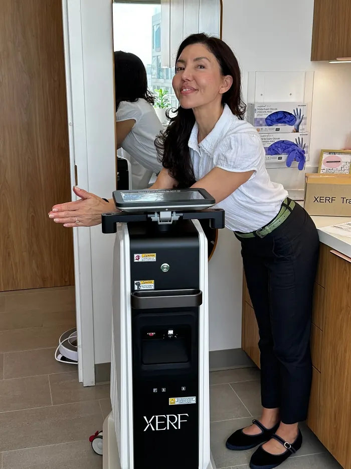 Danielle posing with XERF machine at San Francisco Plastic Surgery